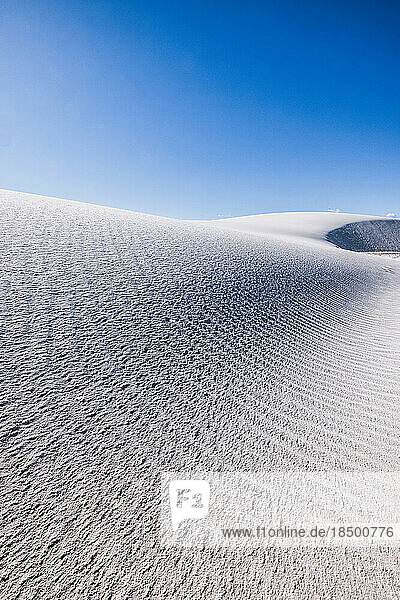 rolling sand dunes and blue sky at White Sands National Park