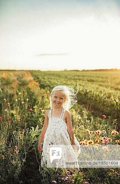 blond girl smiling in wildflower field in Northwest Indiana