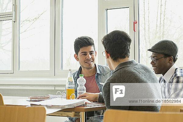 University students discussing in canteen School  Bavaria  Germany