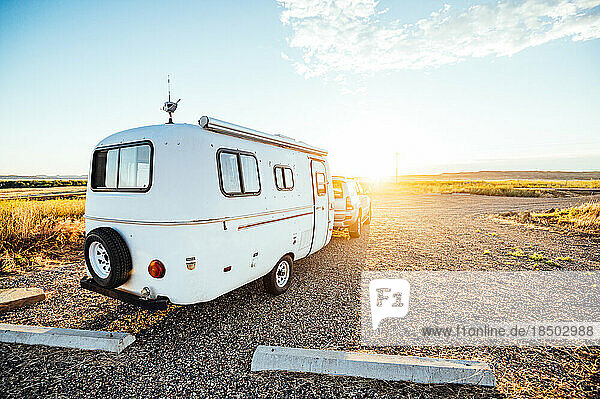 Morning light hitting camper in Montana campsite.
