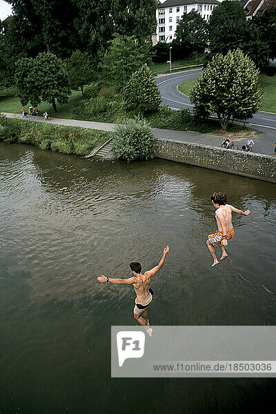 Germany Aschaffenburg Teenage boys take dangerous jump off bridge into Rhine River