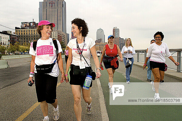 Mother/daughter surivor team walk in the Avon Walk for Breast Cancer in New York City.