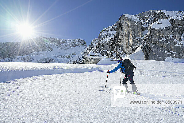 Skier climbing the ski slope  Bavaria  Germany  Europe