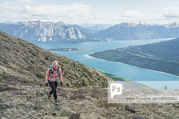 Female Hiker Walking Ridge of Nares Mountain