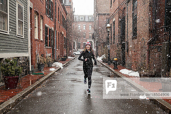 College Girl Running in Snowstorm