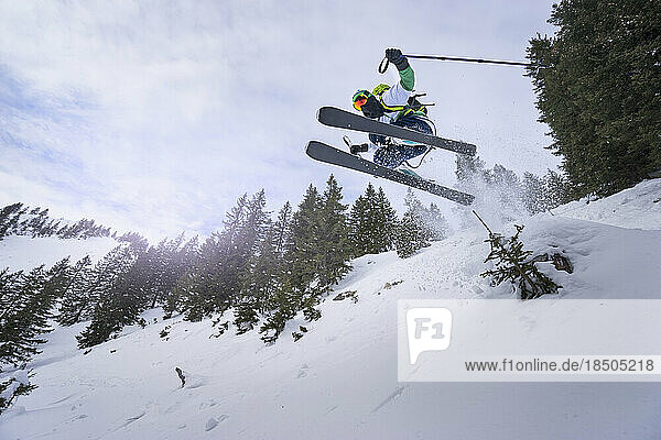 Man jumping with ski  Bavaria  Germany