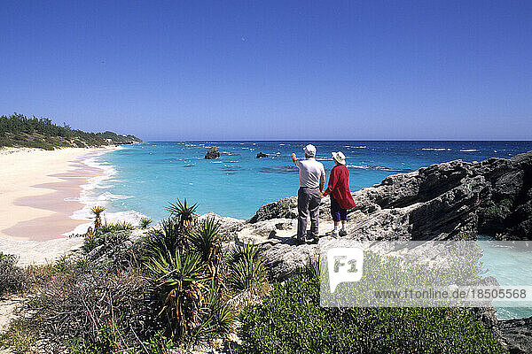 Retired couple enjoy pink sand beaches at Warwick Long Bay Bermuda