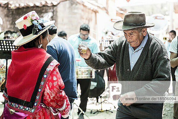 Peruvian older man dancing during a traditional religious celebration