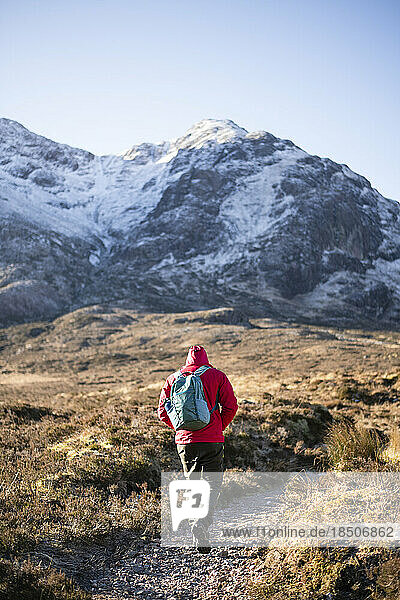 Solo Man hiking in Scottish Highlands in winter