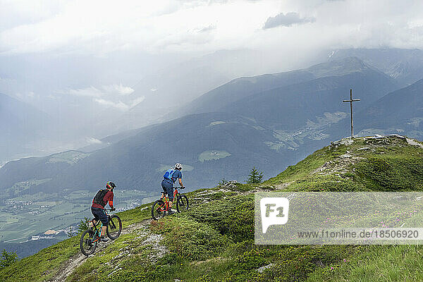 Mountain bikers riding uphill  Trentino-Alto Adige  Italy