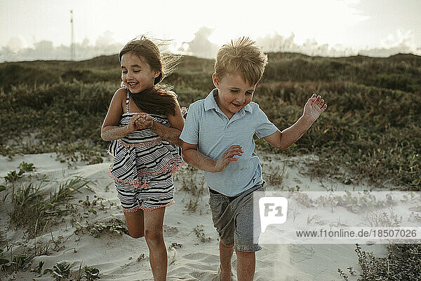 Kids Playing in Dunes at the Beach in Corpus Christi Texas