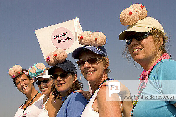 A group of women display their boob hats and Cancer Sucks flag at a breast cancer walk in Washington  DC.