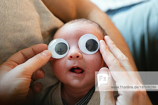 newborn baby with googly eyes