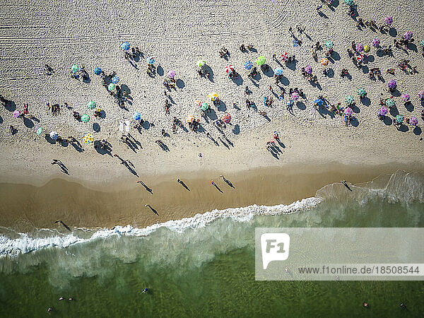Beautiful aerial top down view to Copacabana Beach with umbrellas