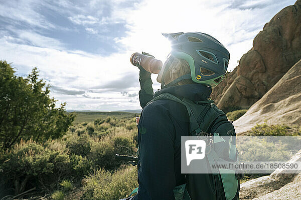 Woman mountain biking in the high desert in Colorado