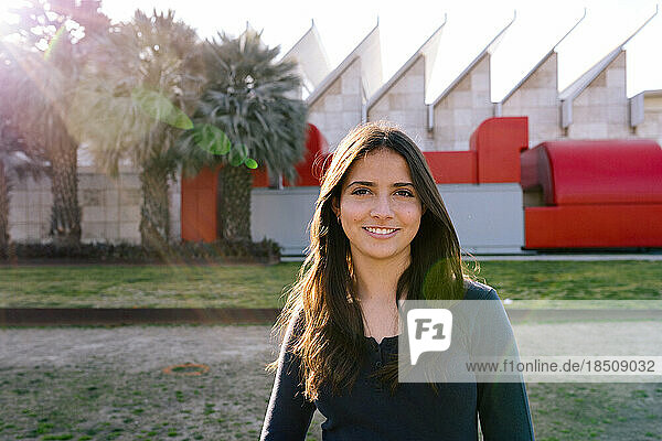 Teen Girl Smiles While Standing In Front Of LACMA