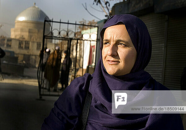 Muslim woman in front of mosque in Kabul.