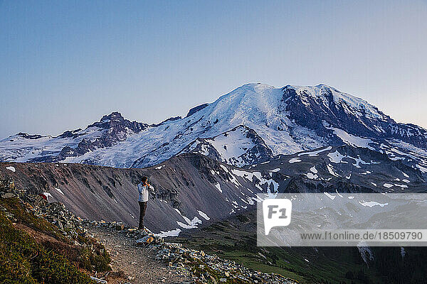 A Man is Taking Pictures of Mt. Rainier in Mt. Rainier National Park