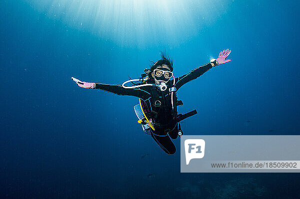 diver floating in the clear waters of the Gulf of Thailand