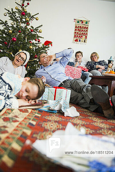 Family celebrating boaring Christmas at home