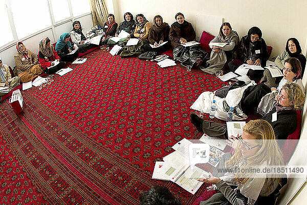 Women attend a business training seminar in Kabul.