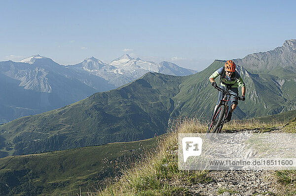 Mountain biker riding on uphill  Zillertal  Tyrol  Austria