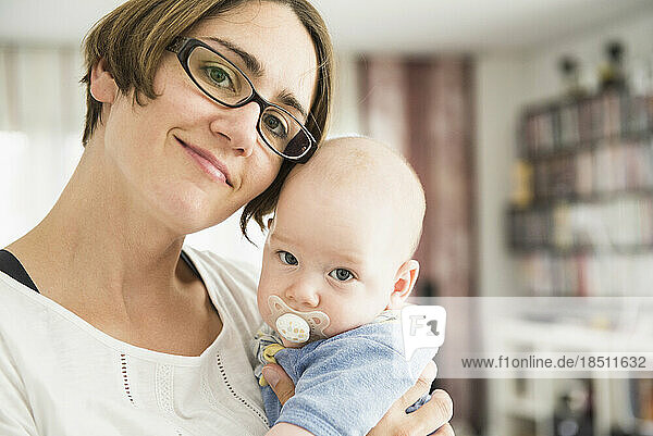 Portrait of mother and baby looking at camera  Bavaria  Germany