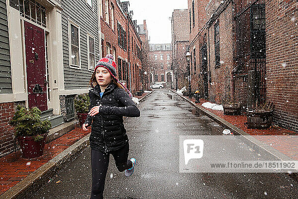 Woman Running in the Snow during Storm