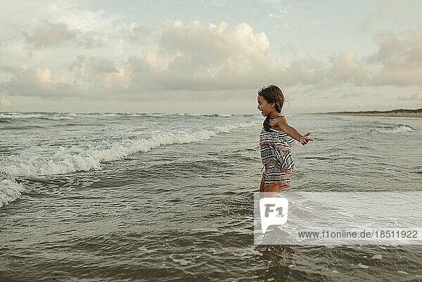 Girl Playing in Ocean Waves in Corpus Christi Texas