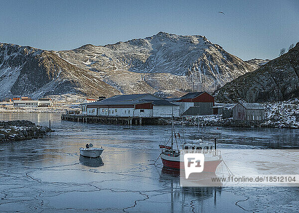 A small fishing boat is frozen in Stunning Norway