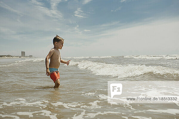 Little Boy in Ocean Playing in Waves Corpus Christi Texas