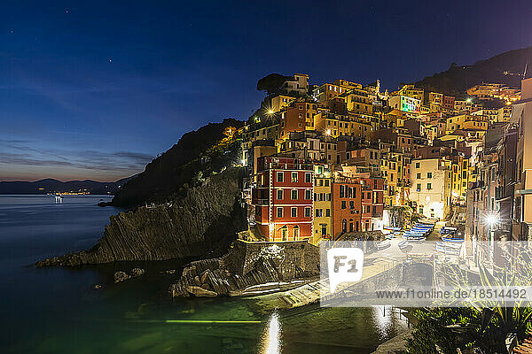 Italy  Liguria  Riomaggiore  Edge of coastal village along Cinque Terre at night