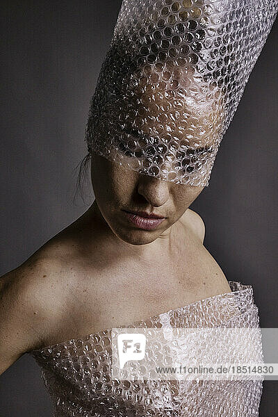 Woman wearing hat with bubble wrap