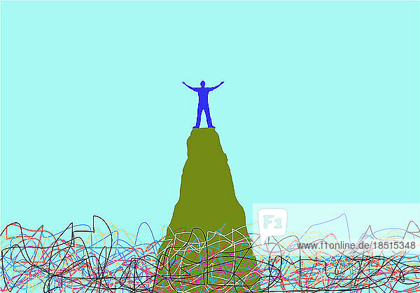 Person standing with raised arms on top of mountain peak
