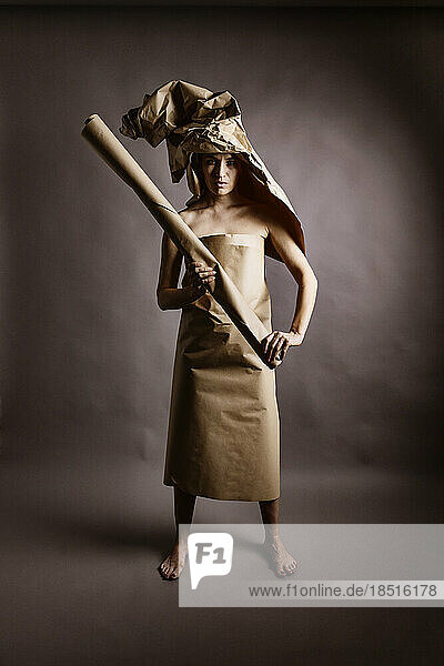 Woman wrapped in brown paper