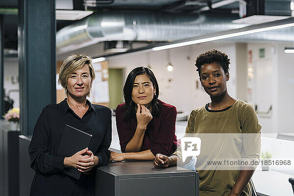 Confident businesswomen standing in office
