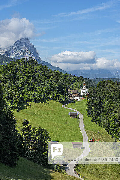 Germany  Bavaria  Wamberg  Road leading to secluded village in Bavarian Alps
