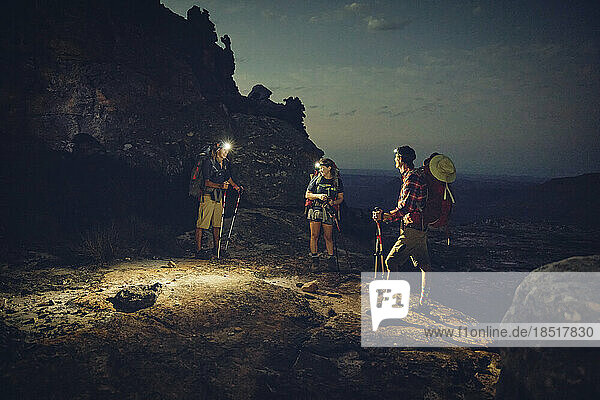 Friends wearing headlamps doing overnight hike on Cederberg Mountains