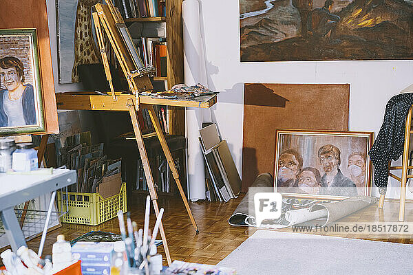 Paintings and art equipment in studio