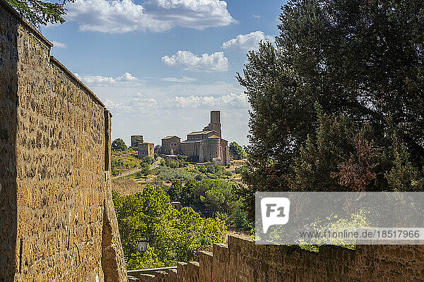 Italy  Lazio  Tuscania  View of Chiesa di San Pietro church in summer with walls in foreground