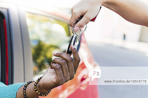 Man taking car key from valet