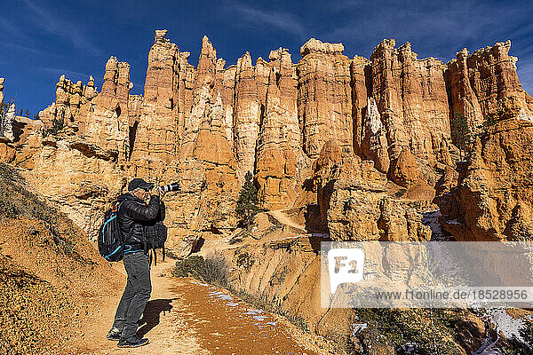 United States  Utah  Senior photographer photographing in Zion National Park