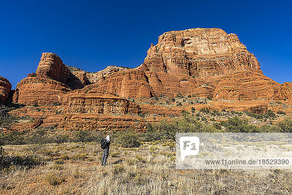 United States  Arizona  Sedona  Senior blonde woman hiking in wilderness