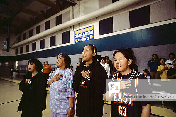 Inuit people pledging allegiance before an athletic event; North Slope  Alaska  United States of America