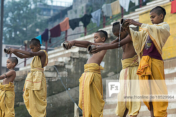 Young brahmin students performing rituals; Varanasi  India