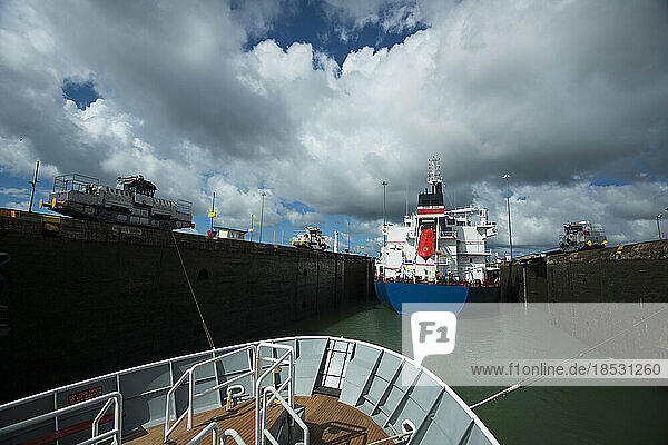 Ships pass through a lock in the Panama Canal; Panama
