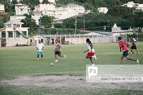 Locals play soccer in the capital city of St. George's  Grenada; St. George's  Grenada