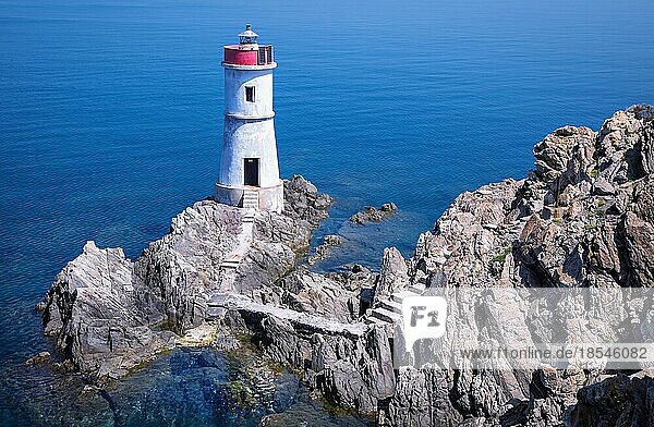 lighthouse against the blue sea