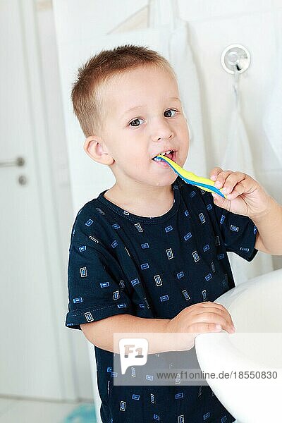 Dental care - small boy washing his teeth