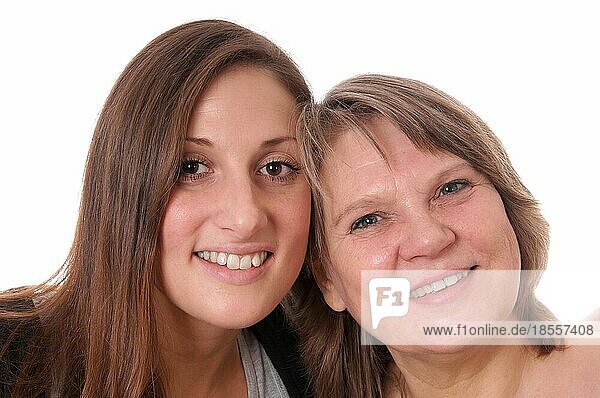 Mother and daughter cheek by cheek